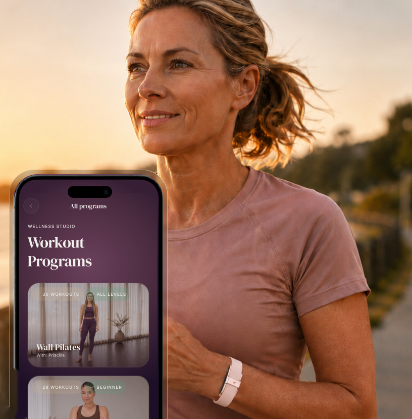 Woman jogging at sunset wearing the RH Band, with workout programs on the RH app